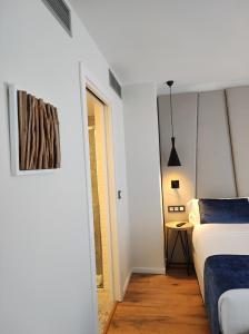 Taverna de la Sal Boutique Hotel客房内的一张或多张床位