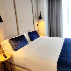 Taverna de la Sal Boutique Hotel客房内的一张或多张床位