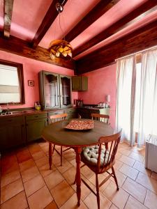 a kitchen with a table and chairs in a room at Marnabianca Apartment in Realmonte