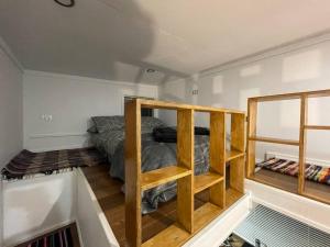 a room with a bed and a bunk bed in it at Tiny home in the hills 
