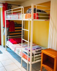 a room with bunk beds in a room at Adéloïa Cottage in Fauverney