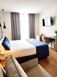 Taverna de la Sal Boutique Hotel客房内的一张或多张床位