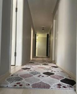 a hallway with a tile floor in a building at Rize , still close to the port in Cayeli