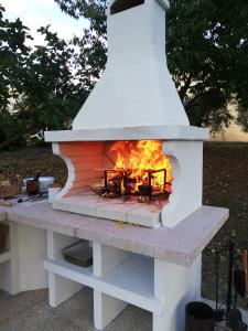 a brick oven with a fire inside of it at Casa Vacanze "Dimora Quercia" - Appartamento "Oliva" in Montefalco