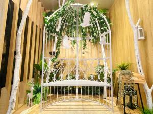 a white gazebo with ivy on it at Finders Hotel Hualien Da-Tong in Hualien City