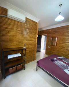 Llit o llits en una habitació de Guest House Shekvetili
