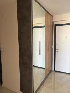 a room with a glass partition with a door at Antalya apartment in Antalya