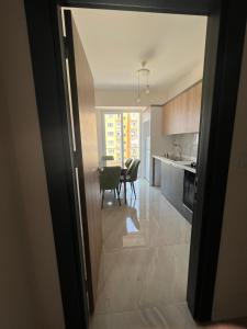 a kitchen and dining room with a table and chairs at Antalya apartment in Antalya