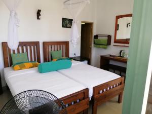 a bedroom with a bed with a blue box on it at Super View in Ella