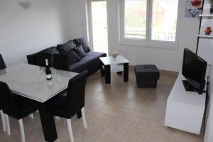 Ein Sitzbereich in der Unterkunft Vila Apartment