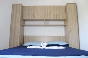 Ein Bett oder Betten in einem Zimmer der Unterkunft Vila Apartment