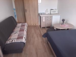 Postel nebo postele na pokoji v ubytování Pokoje Gościnne "ZBYNIO"