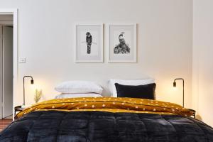 a bedroom with a bed with a yellow blanket at Mistwood - Pet Friendly in Mount Macedon