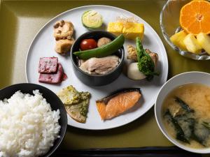 a plate of food with rice and different types of food at La'gent Hotel Kyoto Nijo in Kyoto
