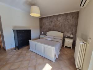 מיטה או מיטות בחדר ב-Il Rifugio Del Capitano 2