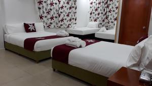 Letto o letti in una camera di Alec's Hotel