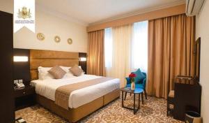 Ένα ή περισσότερα κρεβάτια σε δωμάτιο στο Salalah Royal Hotel Suites +11 φωτογραφίες