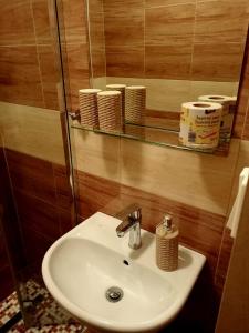 a bathroom with a sink and a mirror at Penzion Lukáš in Malá Morávka