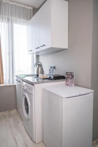 a kitchen with a washing machine and a washer at MY HOME IN TRABZON in Trabzon