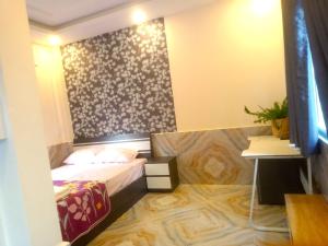 Postel nebo postele na pokoji v ubytování An Chi Hotel