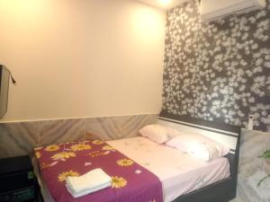 Postel nebo postele na pokoji v ubytování An Chi Hotel