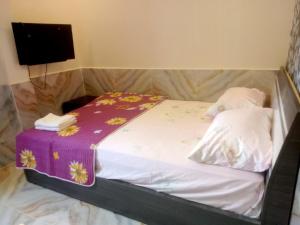Postel nebo postele na pokoji v ubytování An Chi Hotel