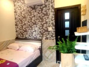 Postel nebo postele na pokoji v ubytování An Chi Hotel