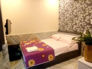 Postel nebo postele na pokoji v ubytování An Chi Hotel