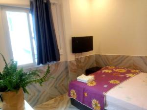 Postel nebo postele na pokoji v ubytování An Chi Hotel