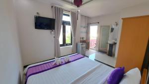Postel nebo postele na pokoji v ubytování Ms Tri Homestay