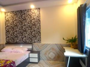 Postel nebo postele na pokoji v ubytování An Chi Hotel