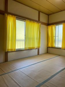 Postel nebo postele na pokoji v ubytování 伊豆 白浜 ゲストハウス茉心