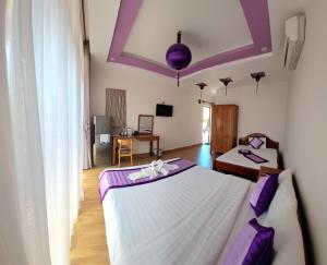Postel nebo postele na pokoji v ubytování Ms Tri Homestay