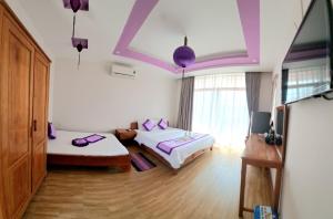 Postel nebo postele na pokoji v ubytování Ms Tri Homestay