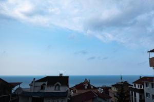 a view of a city with the ocean in the background at MY HOME IN TRABZON in Trabzon