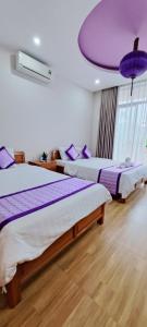 Postel nebo postele na pokoji v ubytování Ms Tri Homestay