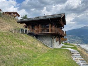 a building on the side of a hill at Chalet Mouflon in Hérémence