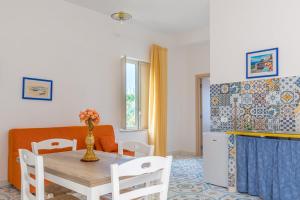 a dining room with a table and chairs at BLUE 51 in Vico Equense