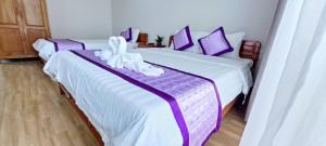 Postel nebo postele na pokoji v ubytování Ms Tri Homestay