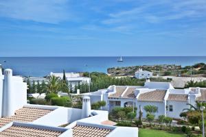 a view of white houses and the ocean at Sao Rafael Holidays in Albufeira