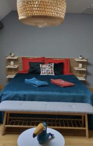Voodi või voodid majutusasutuse La Mirabelle des 3 Forêts toas