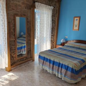 Postel nebo postele na pokoji v ubytování Casa típica de mariscadores