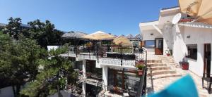 an apartment building with balconies and a patio at Vila pe plaja nr 9 in Saturn