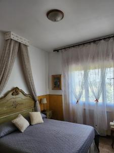 a bedroom with a bed and a large window at Alloggi Adamo Venice in Oriago Di Mira