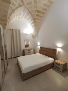 Ένα ή περισσότερα κρεβάτια σε δωμάτιο στο A Casa di Tina