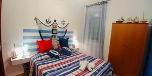 a bedroom with a bed with a crown headboard at VillaMargherita2023 in Porto Palo