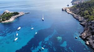 an aerial view of a bay with boats in the water at Hotel Rural Can Maries in Puerto de San Miguel
