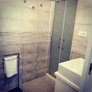 a bathroom with a shower and a sink at KipoRooms in Zollino +33 photos