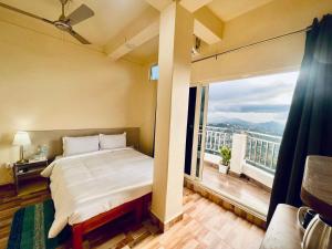 Voodi või voodid majutusasutuse Aizawl Guest House Apartments toas