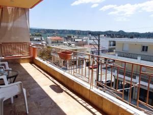 a balcony with a view of a city at The Orange Cactus in Sparta